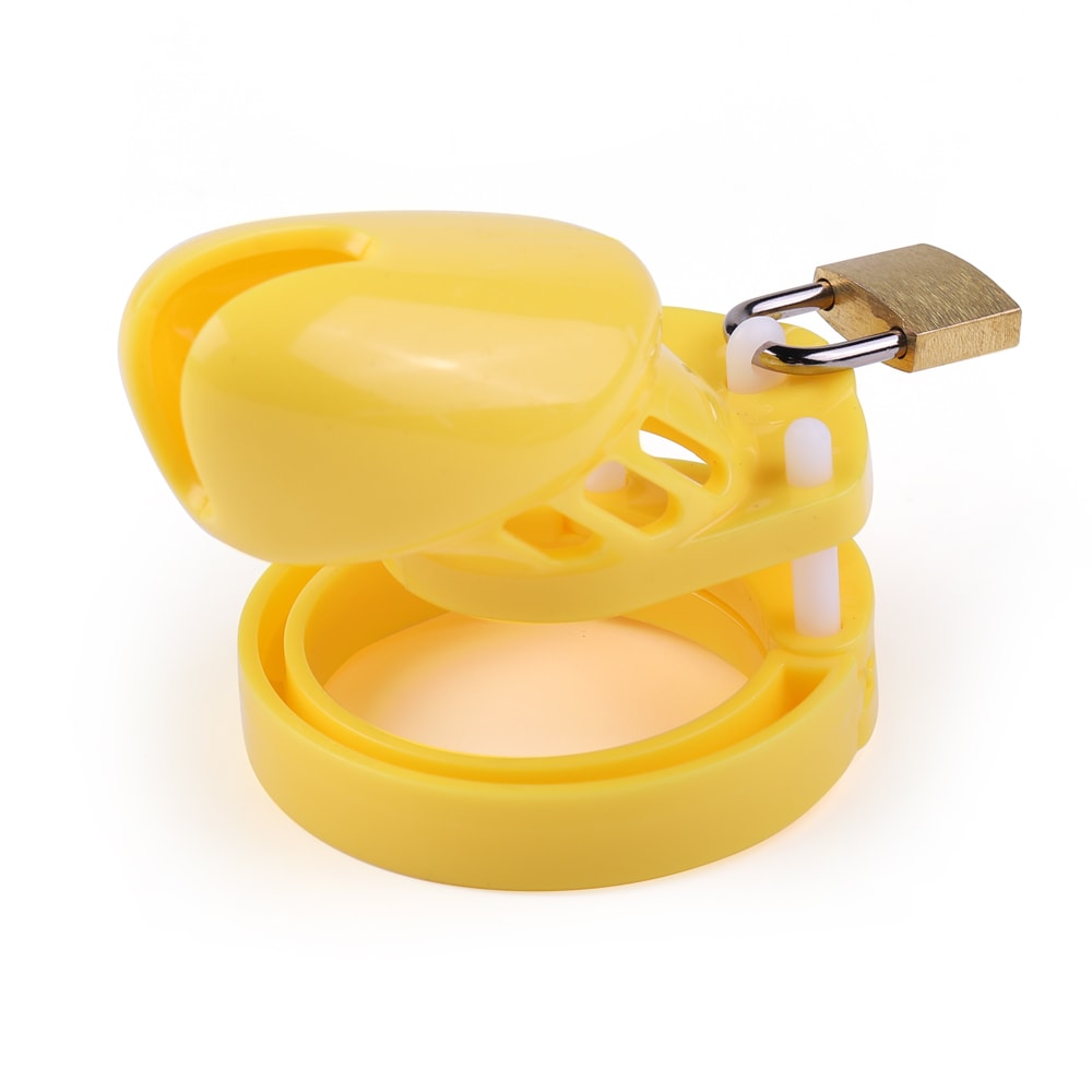 Lock away those big cocks with this sturdy yellow chastity cage, crafted from hard resin, ensuring even discreet public wear. Males craving submission will appreciate the secure, customizable fit, enhancing their BDSM experience.