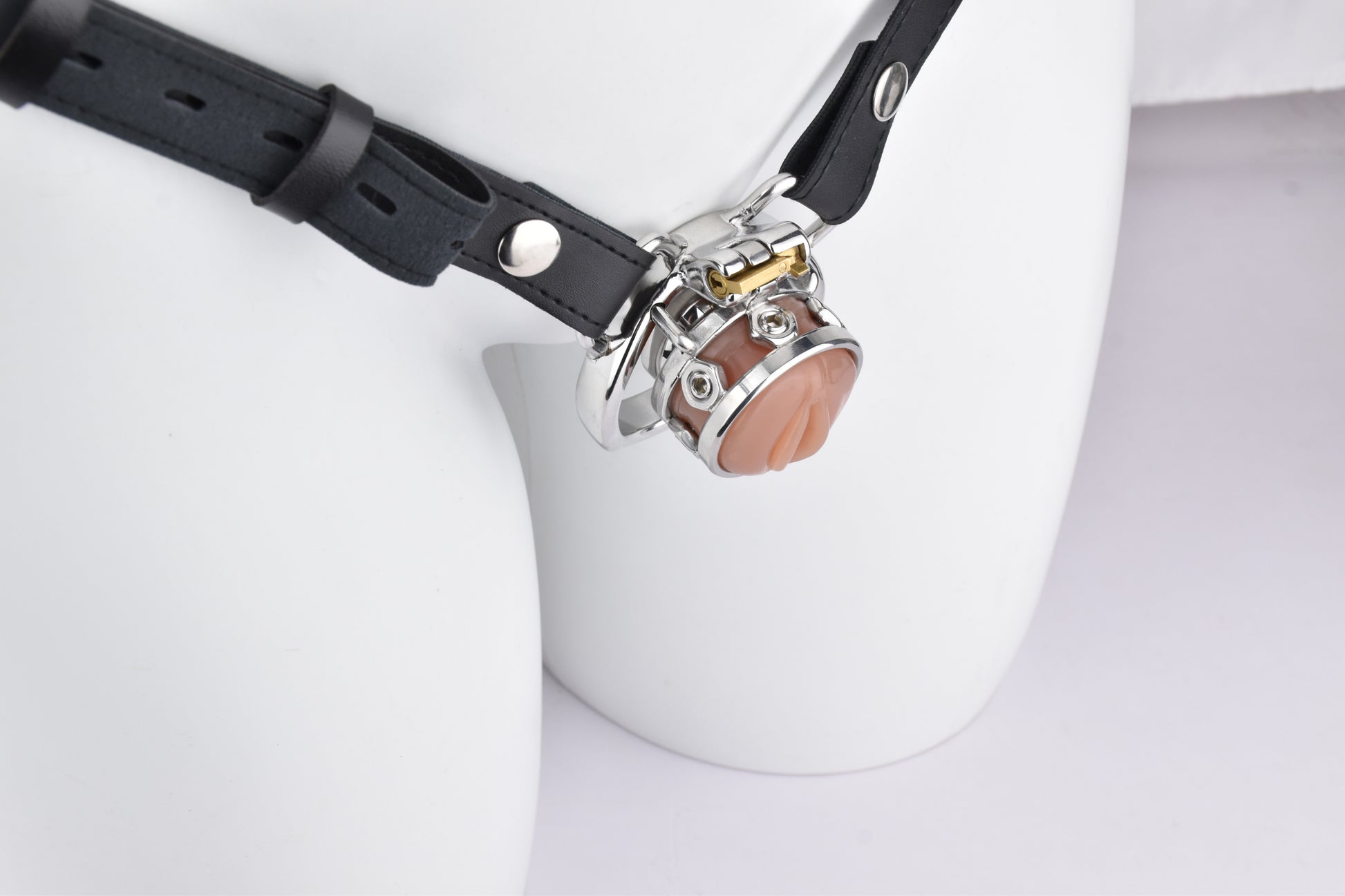 Held in shimmering silver, this chastity device offers a combination of control and elegance. Its robust construction and ergonomic design ensure a careful fit, turning restraint into royalty. With ventilation tips and a discreet lock, it maintains comfort and secrecy in every line of wear, making the wearer feel like a king in submission. Ships with rings and keys for secure, adaptable use.