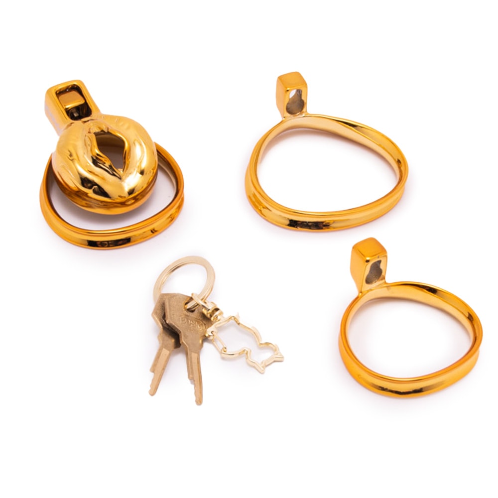 Embrace restraint with our stylish Gold Sissy Metal Chastity device. The discreet cage fits effortlessly under your mini skirt, ensuring no bulges. Perfect for growers, its ergonomic design securely holds your nub while the top-facing lock offers convenient control. Complete with customizable ring sizes and a luxurious velvet bag for storage, it melds comfort with submission seamlessly. Ideal for both long-term wear and psychological play.