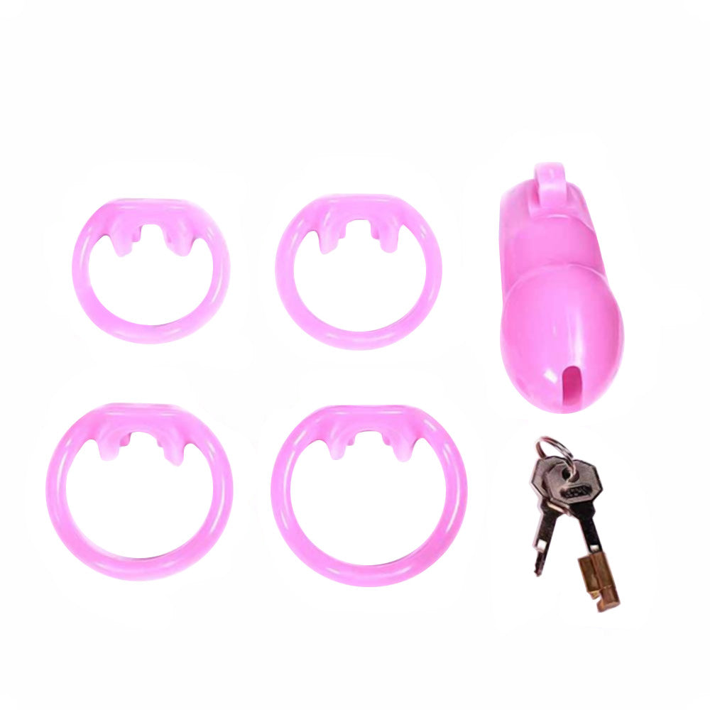 Embrace your submissive side with our Sissy in Pink Silicone Cock Cage. Its sleek design offers breathable comfort, wrapping your desires in thin yet firm restraint. Adjustable rings ensure a snug fit, while the intuitive hinged-lock mechanism simplifies use. Whether exploring long-term wear or seeking discreet public play, this cage's versatile design keeps you stylishly secure. With extra color options, it’s easier than ever to fulfill your fantasies.