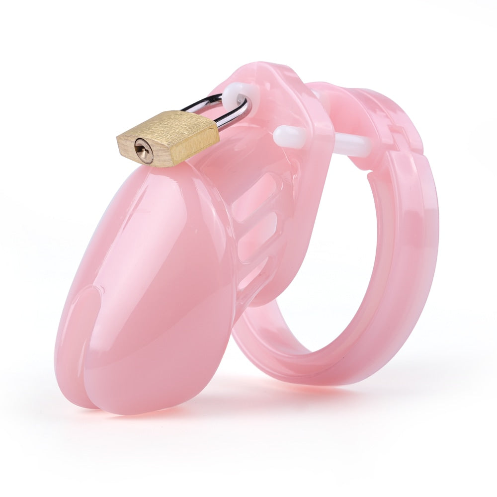 Unlock a world of control with our short, pink, hard resin cage. Inescapable and worn discreetly, it addresses problems of sensation and fit, ensuring comfort and bliss in every moment.
