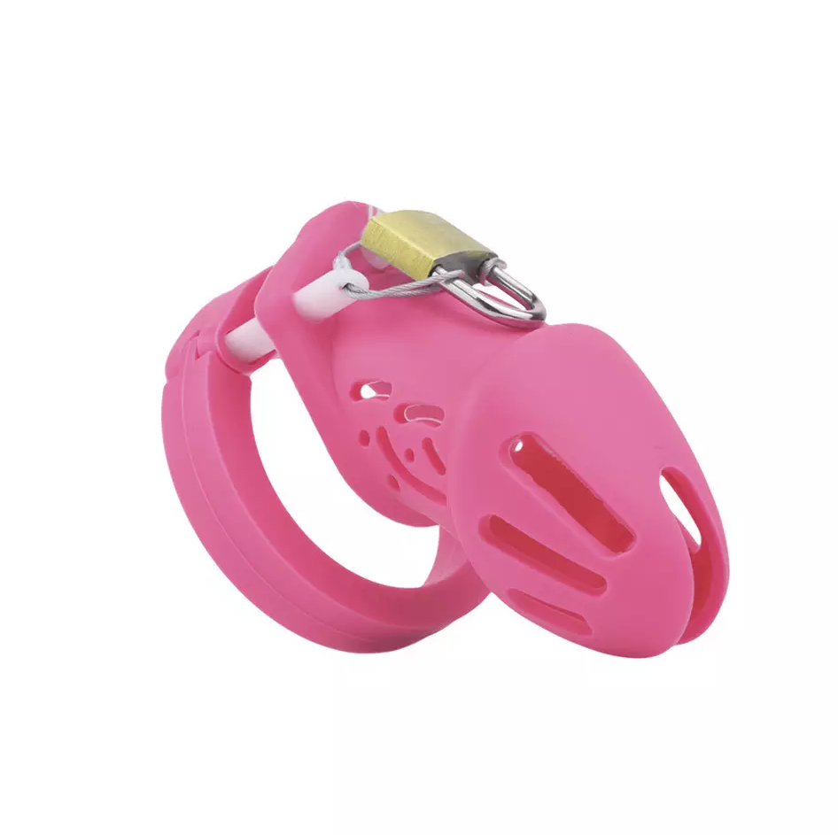 Unlock the allure of discipline with this pink silicone cage. Embrace its flexible yet restrictive design for a snug, personalized fit. Tuck it discreetly and enjoy its wide range of comfort for prolonged wear, offering security and style for every sissy.