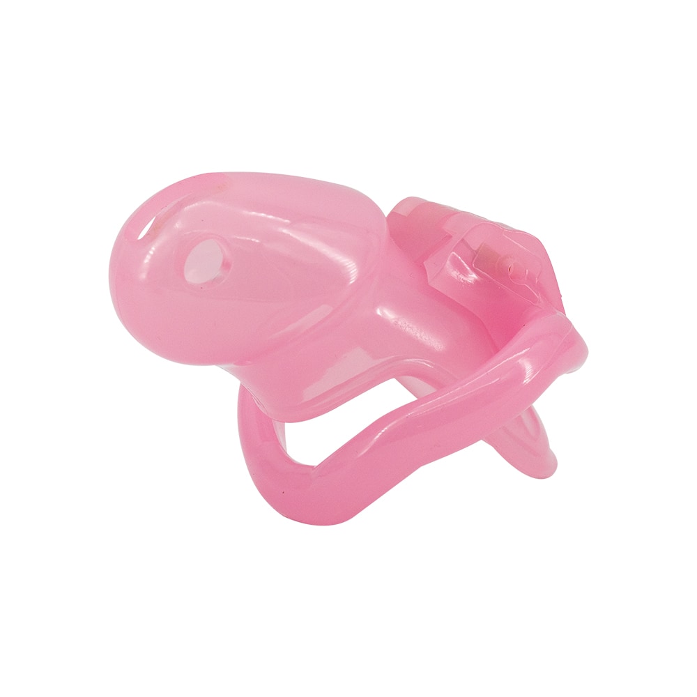 Enhance submission with this pink resin chastity cage. Its snug fit deters erect distractions, while multiple ring sizes adapt to any size. Over time, embrace atrophy and discover the thrill of feeling smaller and more controlled. Ideal for travelers and those exploring sissy play, it maintains dominance from afar, offering psychological satisfaction while keeping your submissive dreams secure.